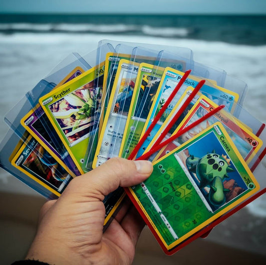 Hand displaying the RubyGator toploaders